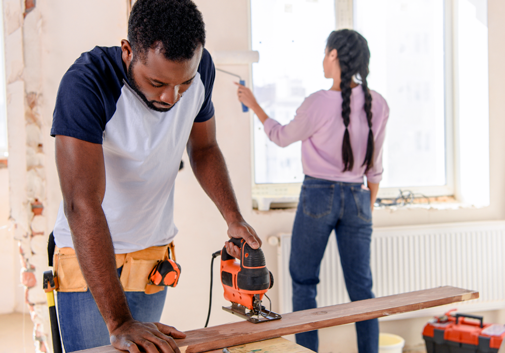 Two people working on home renovations