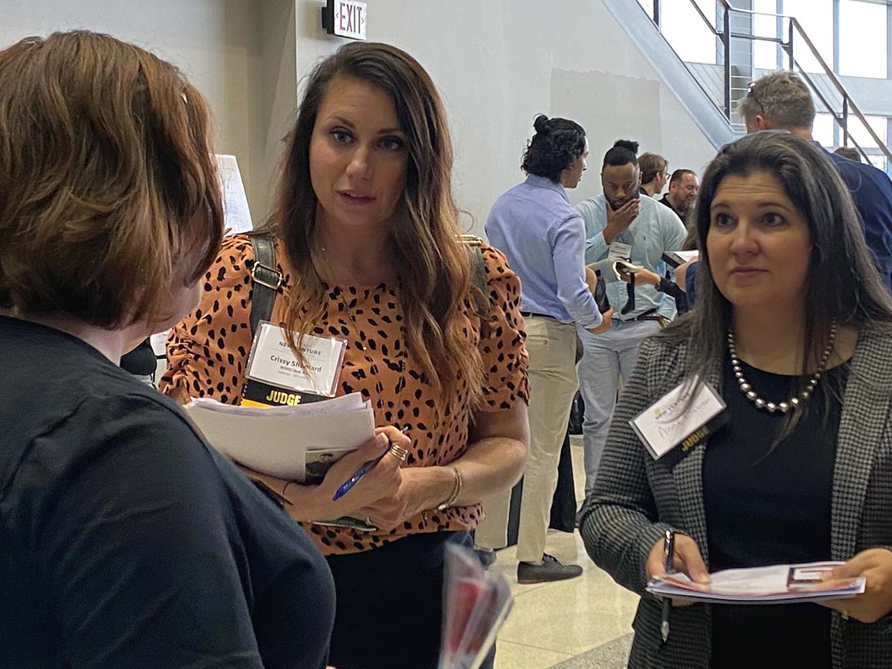 From left: A competition participant answers questions from Shumard and Anna Baker, director - commercial services.