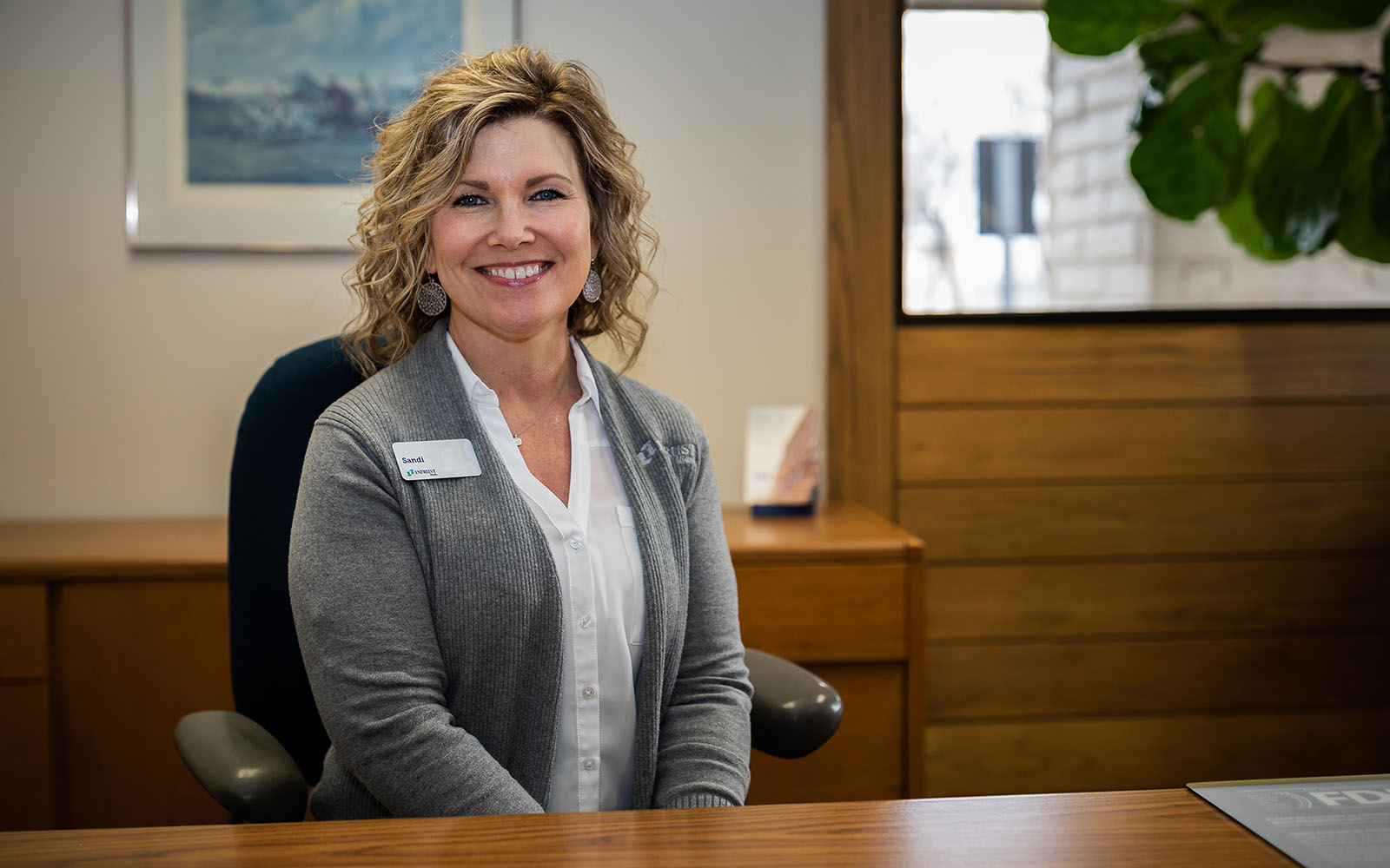 A woman at her desk in a banking center