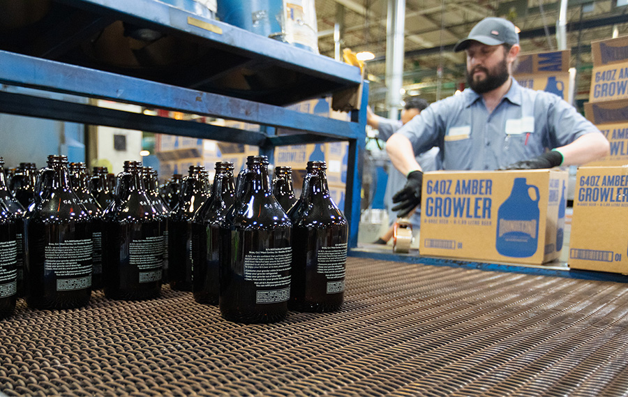 Growlers move through the printing process