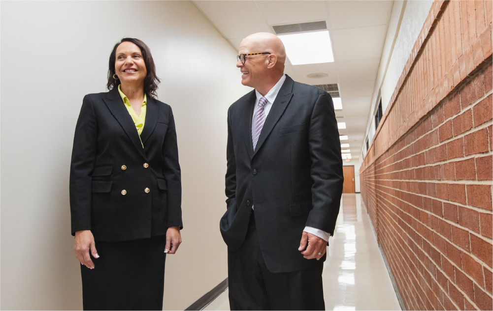 OKCIC employees talking in a hallway